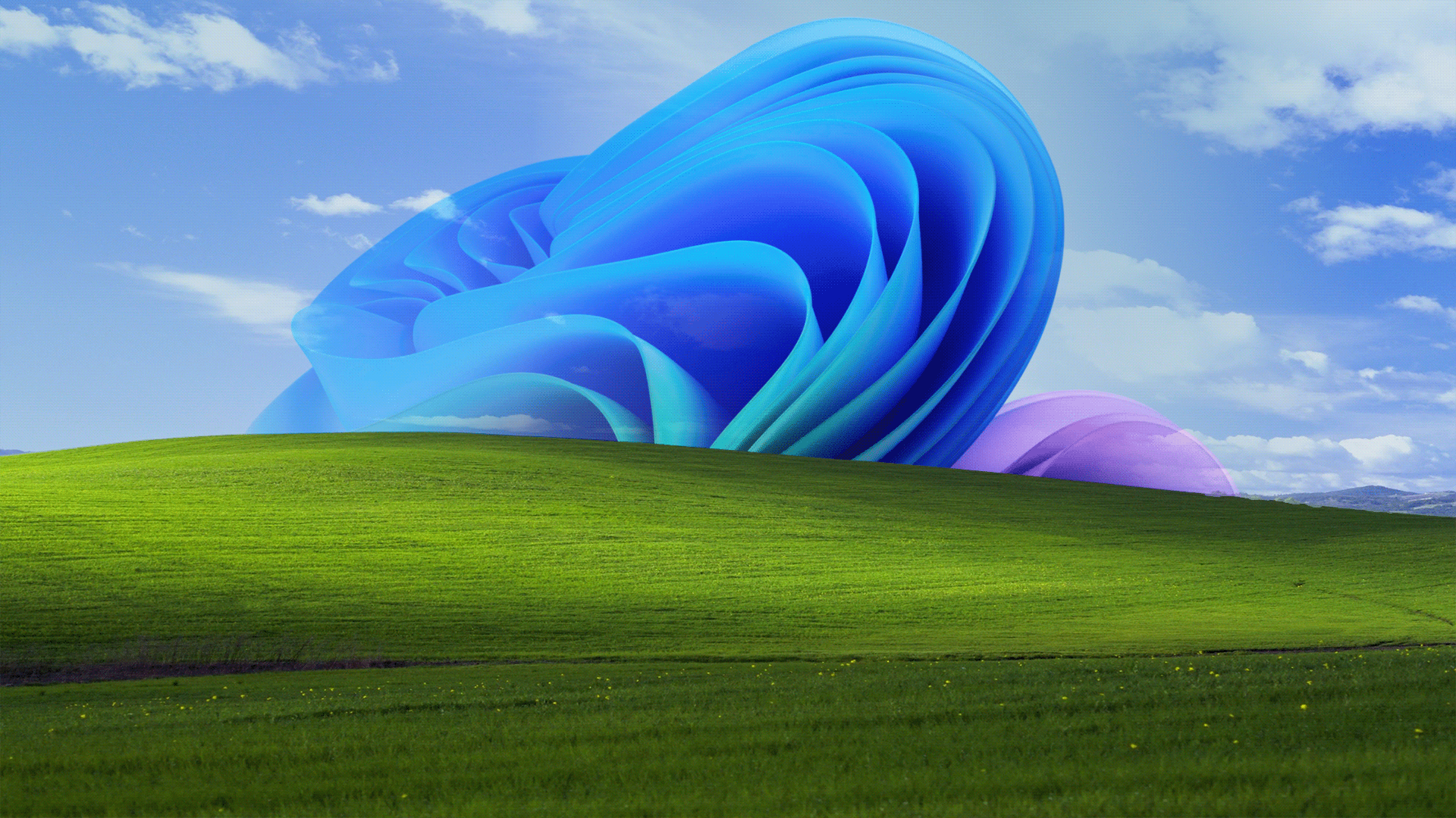 Blue sky with white clouds over a green rolling landscape